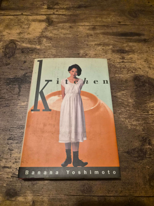 Banana Yoshimoto Kitchen first edition hardcover featuring cover design and illustration.
