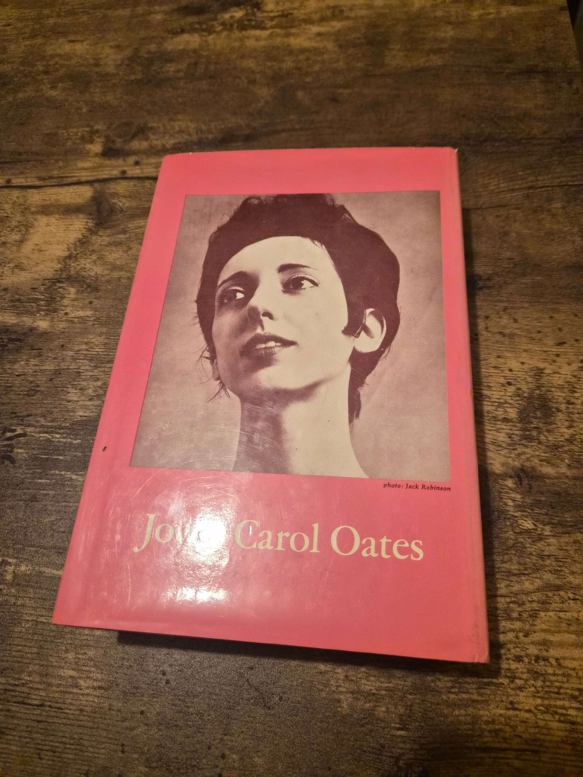 1973 first edition Do With Me What You Will by Joyce Carol Oates, featuring a portrait on a pink cover.